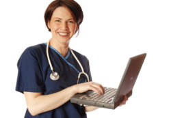 nurse holding laptop